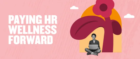 paying-HR-wellness-forward, person-sitting-with-laptop-and-abstract-flower-background